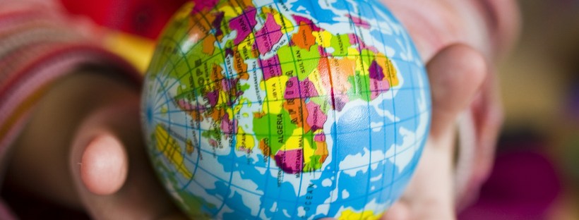 world globe hands holding travel