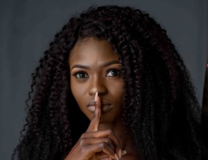 Woman shhh be quiet don't tell secret